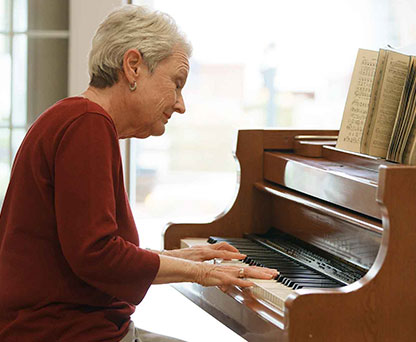 Resident playing piano at Birmingham Green